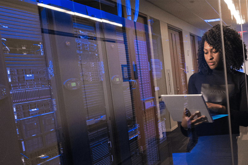 Staff using a computer beside the server room.
