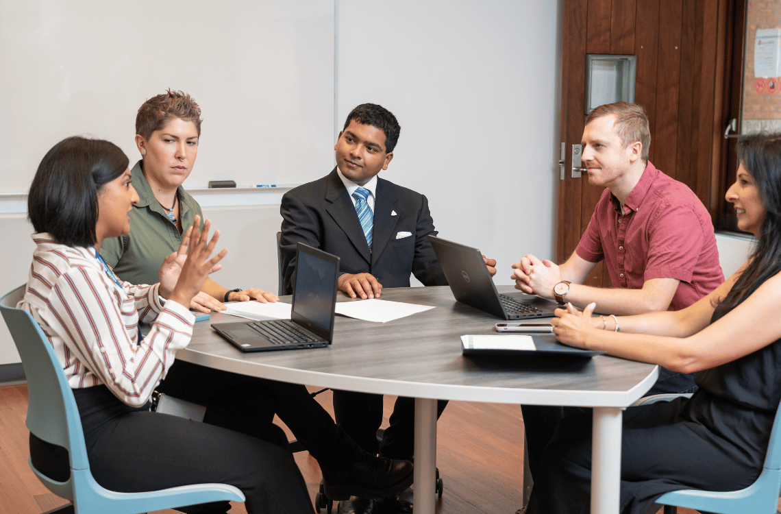 A group of people collaborating in a meeting.