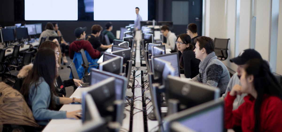 Students collaborating in a computer lab.